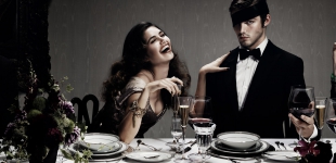 Samantha wears asymmetric gold bustier dress Vivienne Westwood Gold Label; Jake wears shirt Dries Van Noten - tuxedo Ralph Lauren.